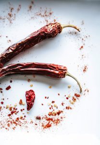 red chili on white surface